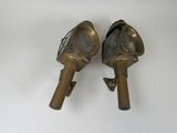 pair of antique brass fire hydrants on a white background