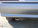 a close up of a car ' s rear end with the tail light on