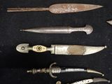 a lot of different types of knives on a table