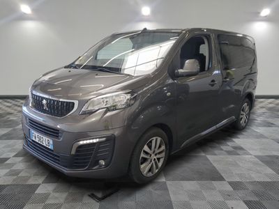 the grey van is parked on a checkered floor in a room