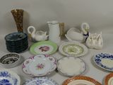 a lot of plates that are sitting on a table