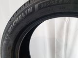 a close up of a tire on a table with a white background