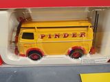 a toy fire truck in a box on a table