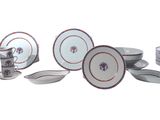 many different types of plates and bowls on this table