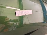 a person taking a picture of a sign on the windshield of a car
