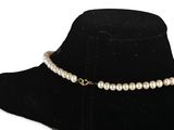 a close up of a necklace on a mannequin mannequin