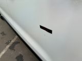 a sticker on the door of a white car