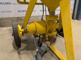 a yellow machine that is sitting on the ground