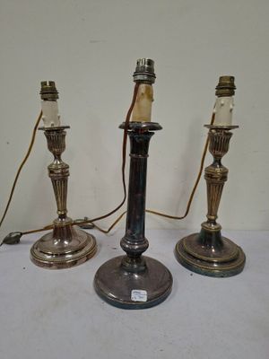 three candles that are sitting on a table