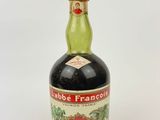 an image of a bottle of liquor with a wooden stopper