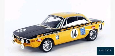 a yellow and black model of a car on a white surface
