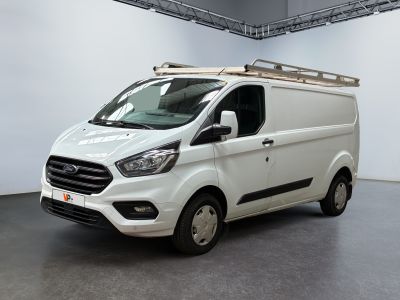 the white van is parked in a large room with white walls