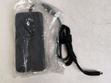 a remote control in a plastic bag on a table