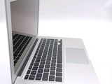 a close up of a laptop computer on a white surface