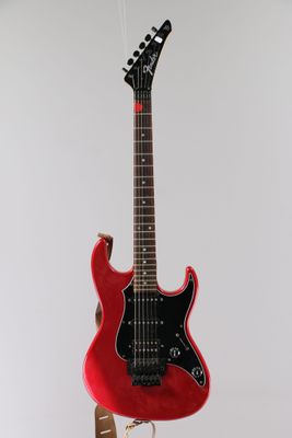an electric guitar on a stand with a white background