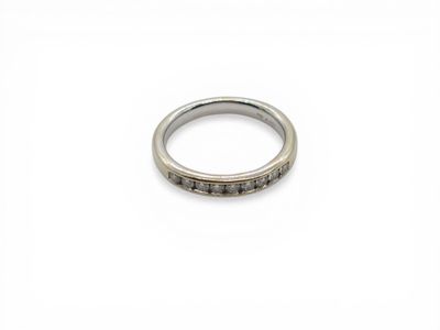 a close up of a ring on a white surface