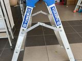 a ladder that is sitting on the floor in a room