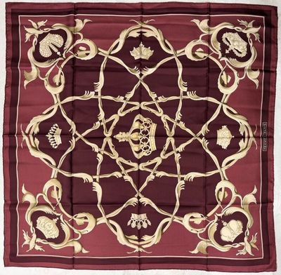 a close up of a square scarf with skulls on it