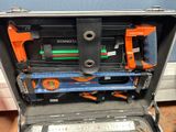 a tool case with tools inside of it on the floor