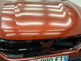 a picture of a car that has been painted orange