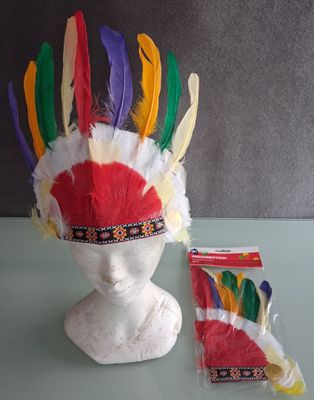 a white headdress with colorful feathers on top of it