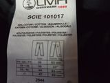 the label on the back of a black jacket shows the size of the jacket