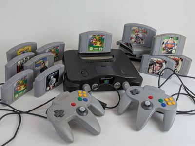 several video game controllers are sitting next to each other on a table