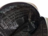 a close up of a purse with a zipper on it
