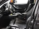 a picture of a black car with the door open