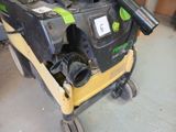 a machine that is sitting on a cart in the garage