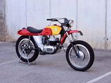 a red and yellow motorcycle parked in a parking lot