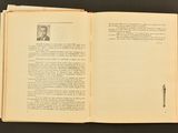 an open book with a picture of a man in a suit and tie
