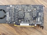 a close up of a video card sitting on top of a wooden table