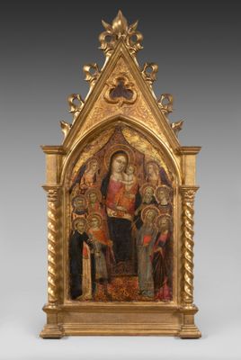 un autel richement décoré et plaqué or, sur lequel figure une peinture représentant la Vierge entourée d'anges