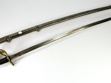 pair of japanese swords with gold - plated handles and wooden sheaths