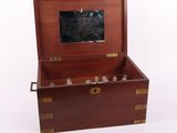 a small wooden box with a mirror inside of it