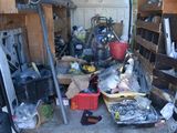 a picture of a garage with a lot of junk in it
