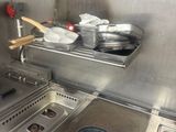 pots and pans are on the stove in a commercial kitchen
