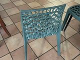 two chairs that are sitting on the floor in the kitchen