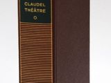 the book is brown and green with a yellow ribbon around it