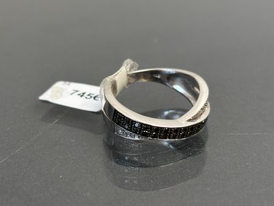 an image of a ring with black diamonds on it