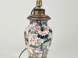 a lamp that is sitting on a table with a light on it