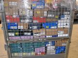 a metal cart with many boxes on it in a warehouse