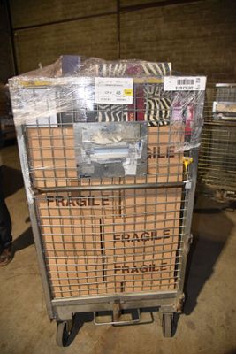 a cart full of boxes and packages in a warehouse