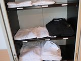 a closet with a lot of clothes in it