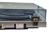 a record player sitting on top of a metal case
