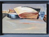un tableau représentant un bateau posé sur une table