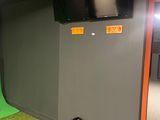 a green screen in the corner of a room