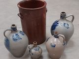 four vases sitting next to each other on the floor