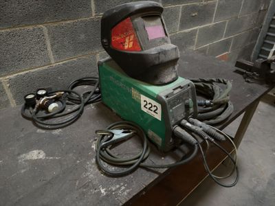 a welder that is sitting on a table in a room